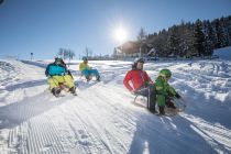 Rodeln am Schatzberg in Auffach. • © Ski Juwel Alpbachtal Wildschönau