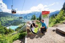 Rutschen bei perfekter Aussicht im Waldrutschenpark am Erlebnisberg Golm im Montafon.  • © Golm Silvretta Lünersee Tourismus, Stefan Kothner